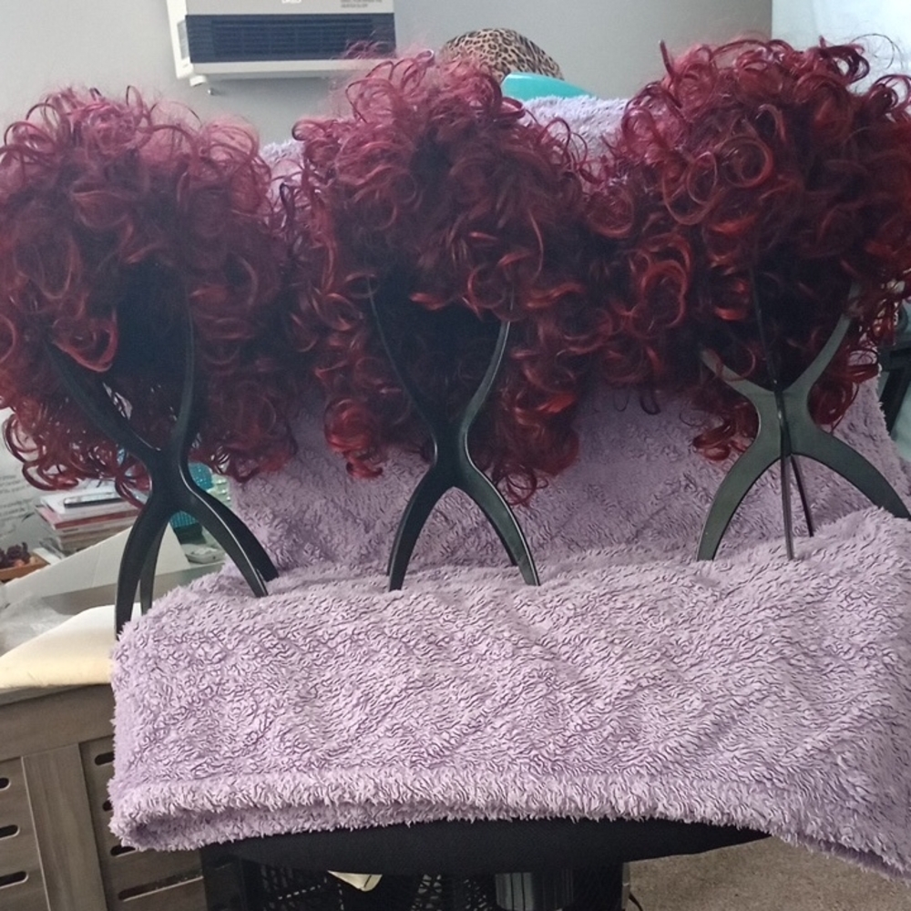 Curly Burgundy Wig for Women, New, $15.00 Per Wig.